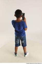 TIMBO STANDING POSE WITH GUN